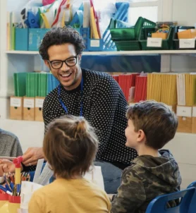 Teacher working with primary school pupils