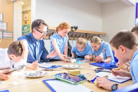 Pupils and teachers reviewing seashore education resources