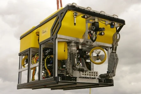 Yellow Holland I remotely operated vehicle suspended from lifting gear